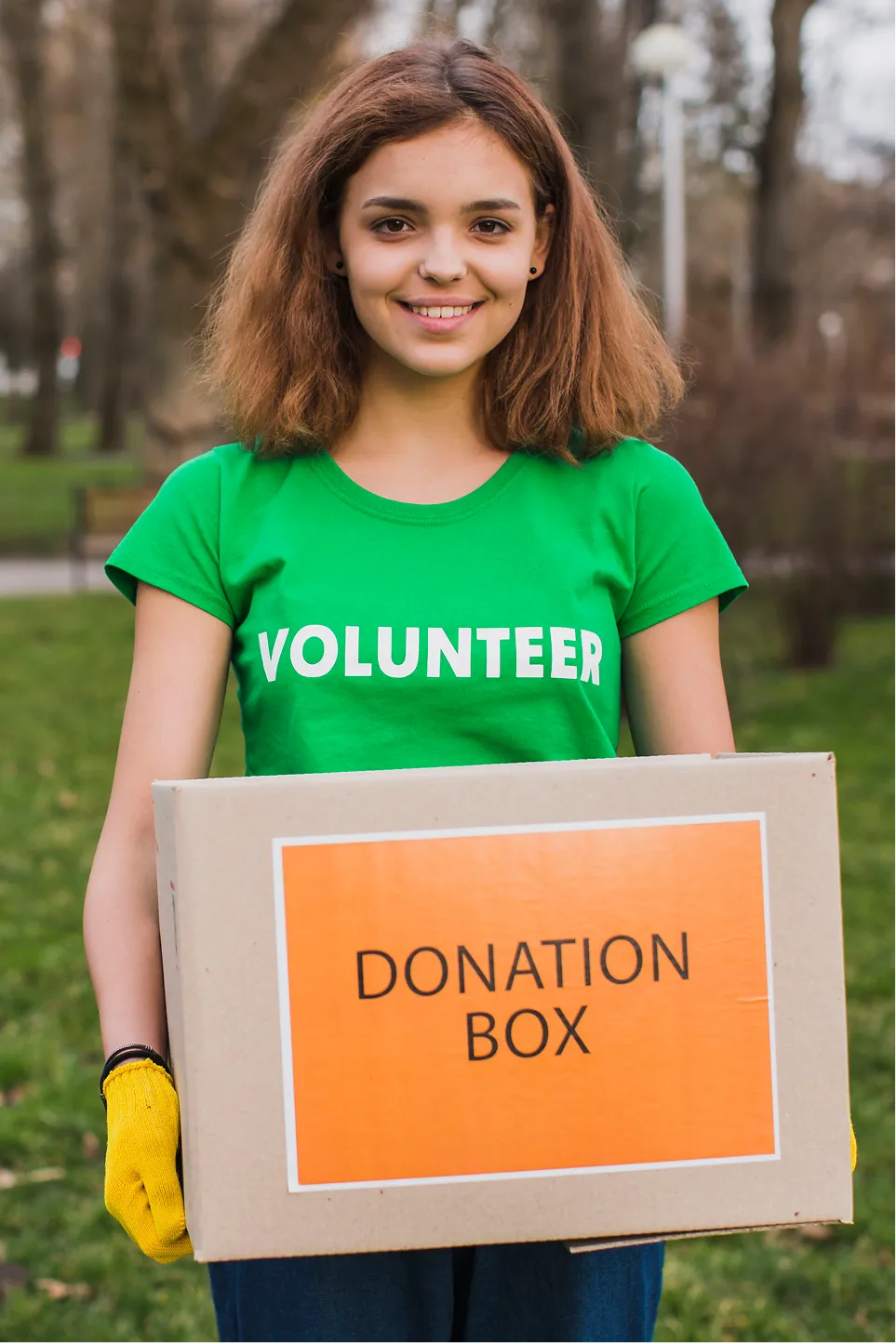 female-volunteer-holding-box-donations