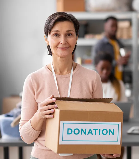 volunteer-helping-with-donation-box